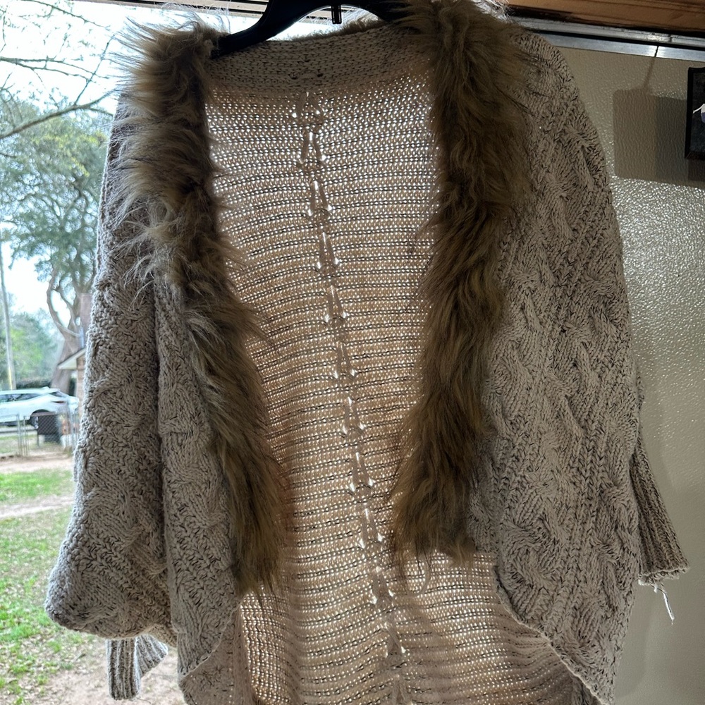 Beige jacket with fur around front
